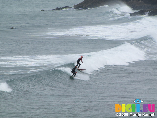 SX07000 Surfers on wave at Bude